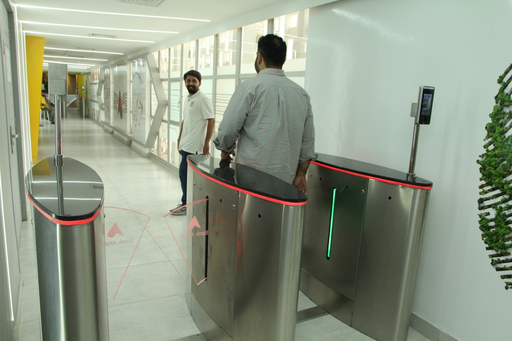 man passing after scanning his face in the automated system
